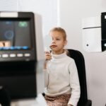 A Girl in White Top Covering Eye While Undergoing a Vision Test